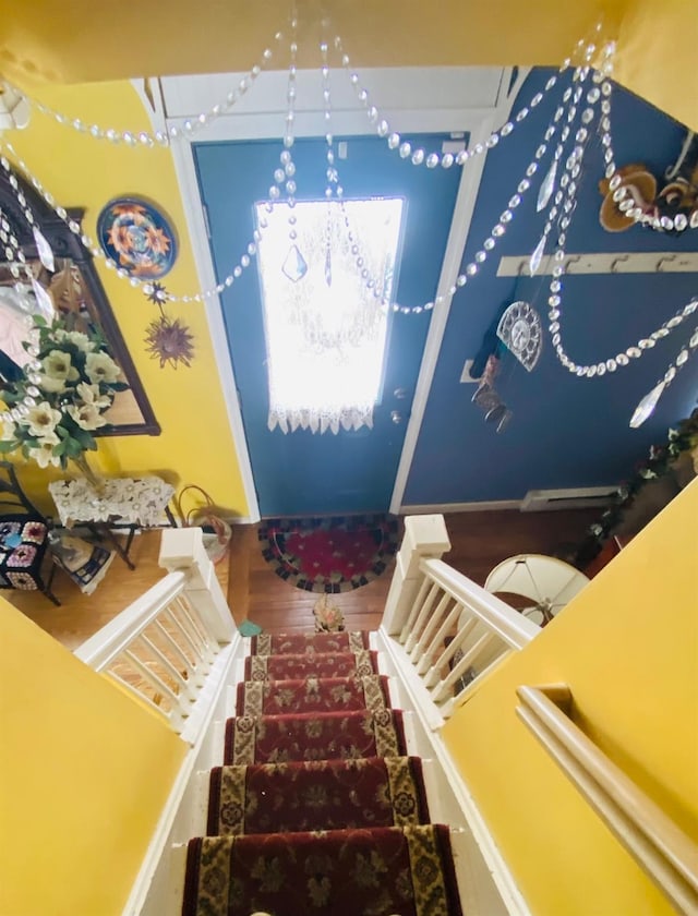 staircase featuring hardwood / wood-style floors