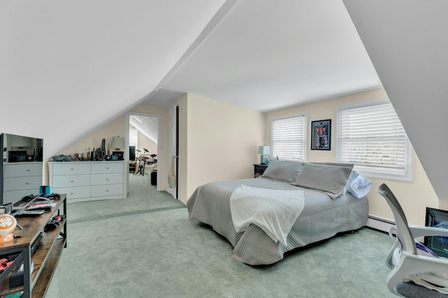 bedroom with carpet floors and lofted ceiling