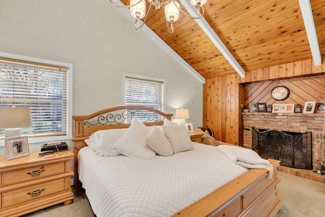 bedroom featuring a brick fireplace, beam ceiling, light colored carpet, and wooden ceiling