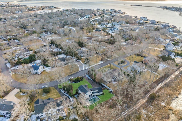 drone / aerial view with a water view and a residential view