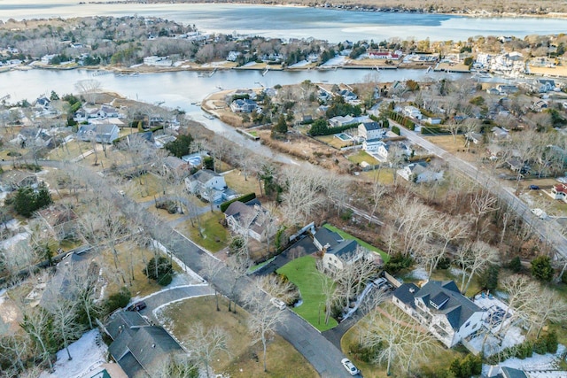 birds eye view of property featuring a water view and a residential view