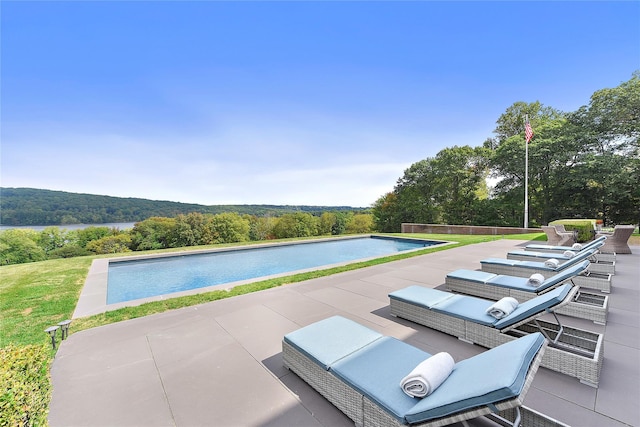 view of swimming pool featuring a patio area