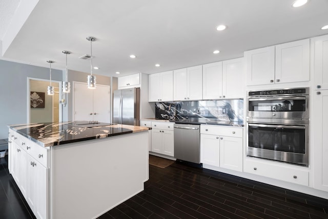 kitchen with white cabinetry and appliances with stainless steel finishes