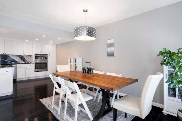 dining area with dark hardwood / wood-style floors