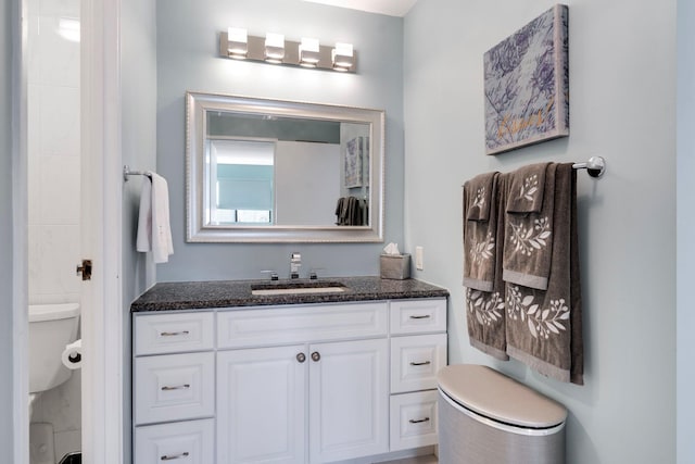 bathroom with vanity and toilet