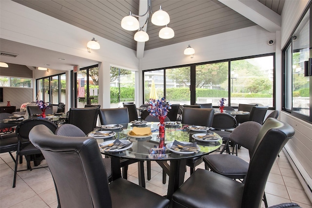 tiled dining room featuring vaulted ceiling with beams, wood ceiling, a notable chandelier, and a healthy amount of sunlight