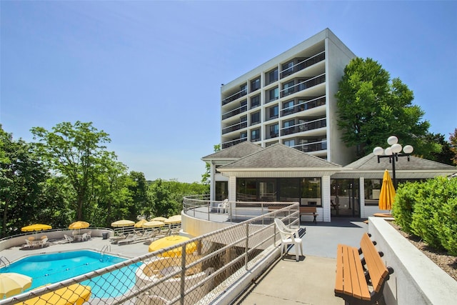 view of swimming pool featuring a patio and a gazebo