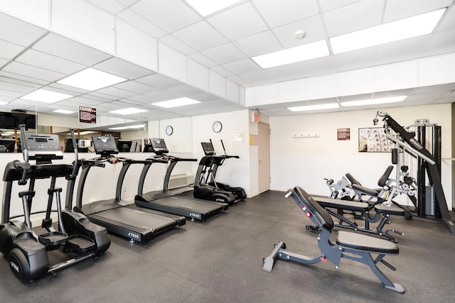 exercise room featuring a drop ceiling