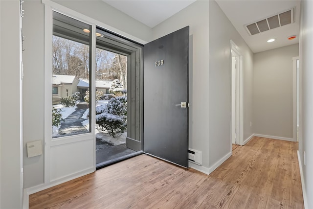 entryway with visible vents, recessed lighting, baseboards, and wood finished floors