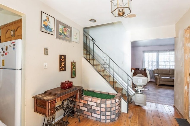 stairs featuring wood-type flooring