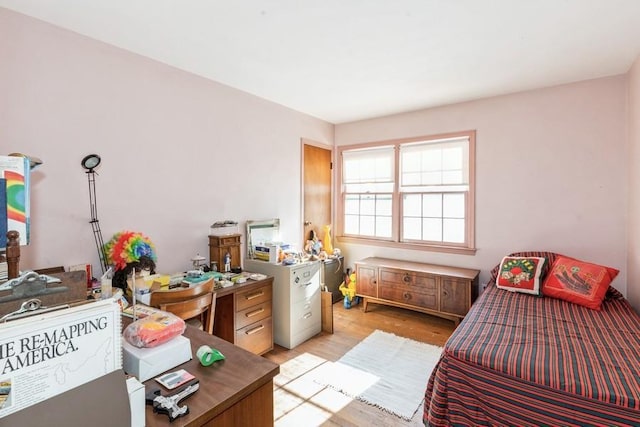 bedroom with light wood-type flooring