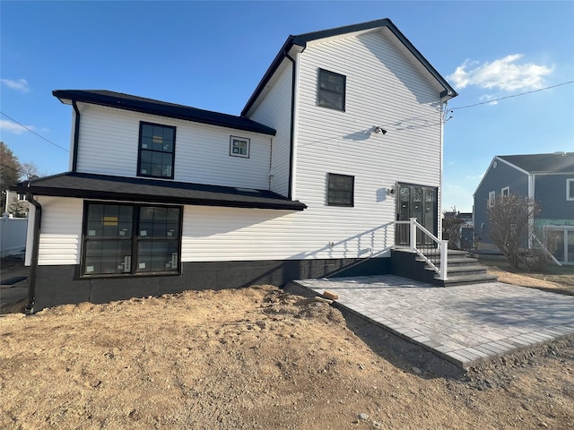 back of house with a patio