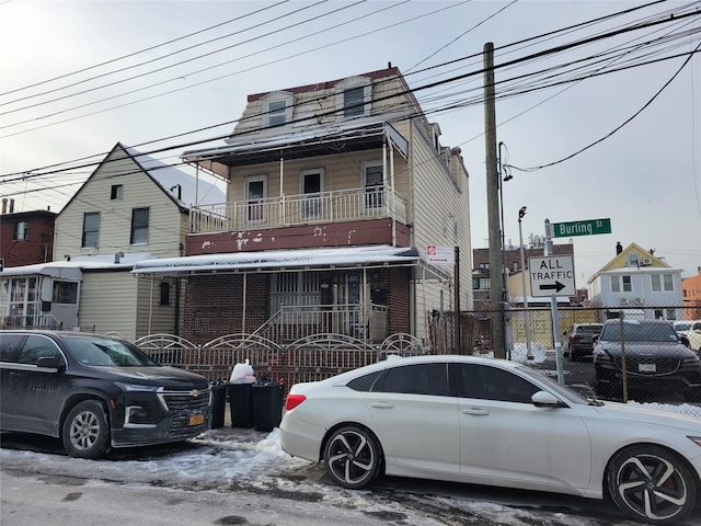 view of front of house with fence