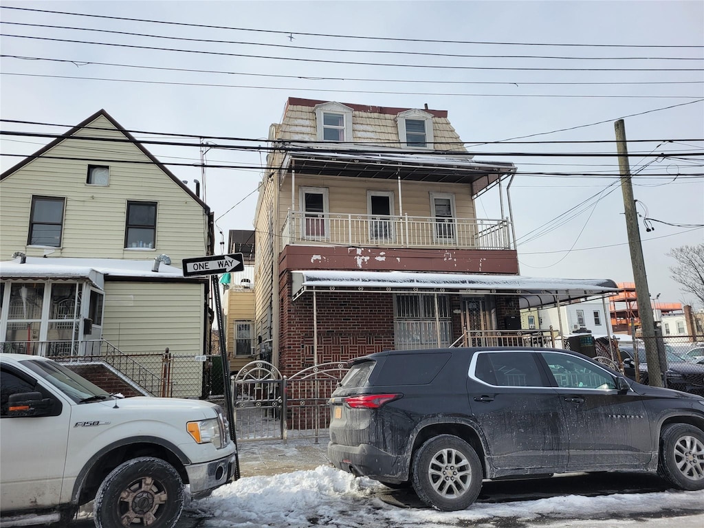 view of front of home with a balcony