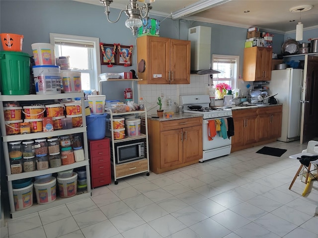 kitchen with white appliances, brown cabinetry, decorative backsplash, wall chimney exhaust hood, and ornamental molding