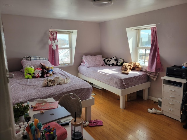 bedroom with light wood finished floors