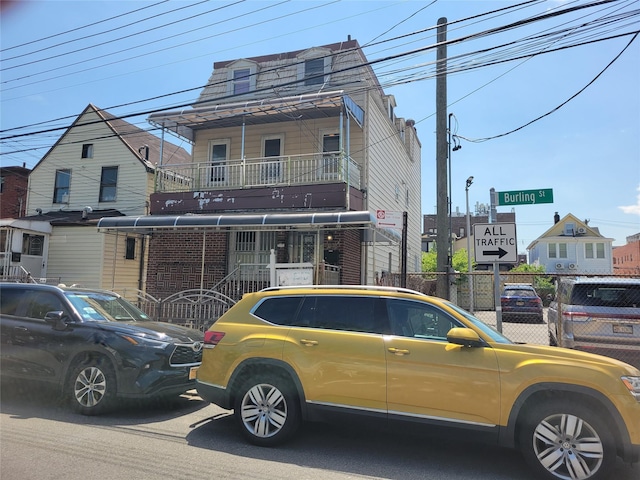 45-24 Burling St, Flushing, NY 11355 - townhome / multi-family property with fence and brick siding