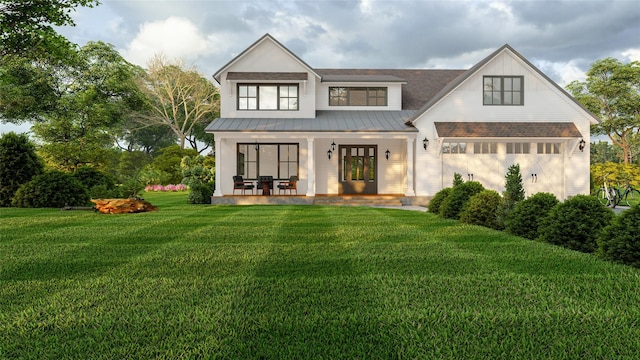 view of front facade with a garage, covered porch, and a front lawn