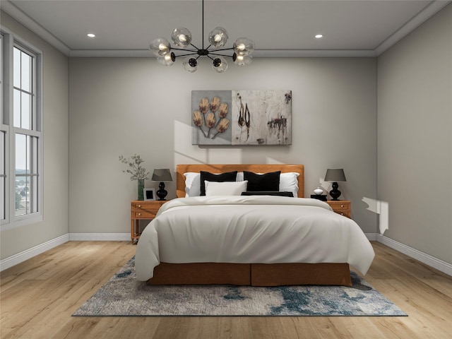 bedroom with light wood-style floors, multiple windows, and ornamental molding