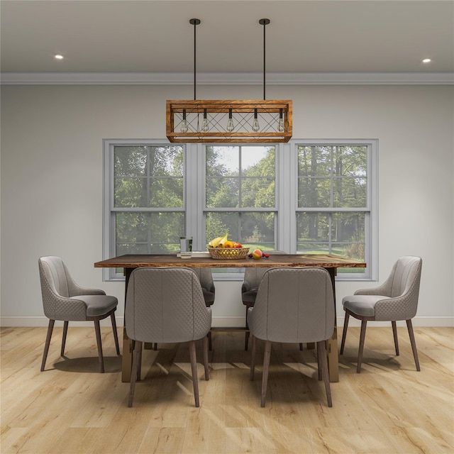 dining area with breakfast area, crown molding, light wood-style flooring, and baseboards