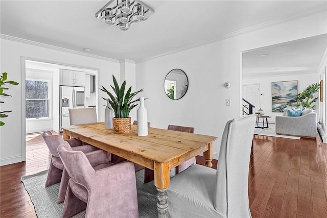 dining area featuring crown molding and dark hardwood / wood-style floors