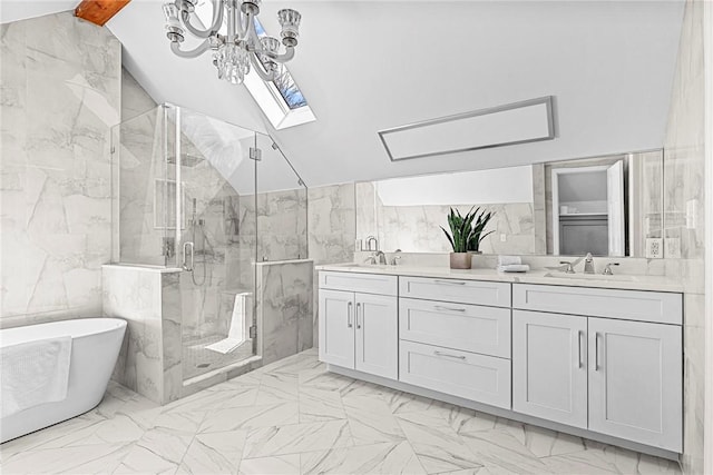 bathroom with vanity, vaulted ceiling with skylight, tile walls, and plus walk in shower