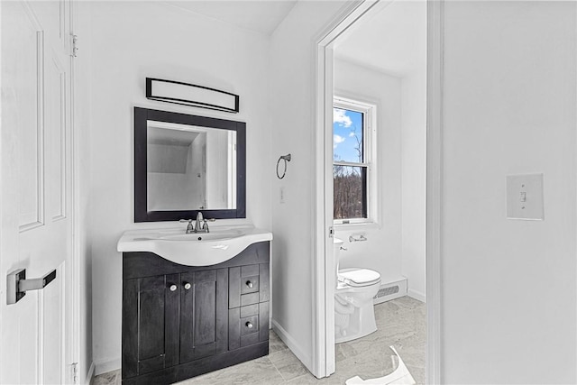 bathroom with vanity and toilet