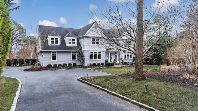 view of front of home with a front lawn