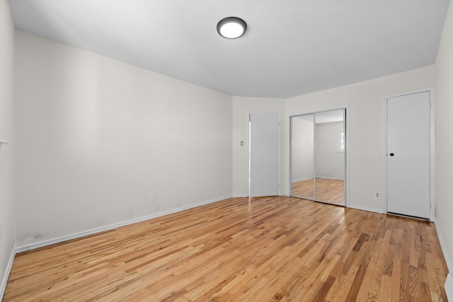 unfurnished bedroom featuring light wood-type flooring