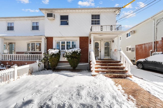 view of front of property with a balcony