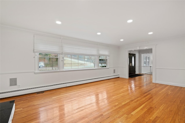 unfurnished living room featuring a baseboard radiator, light hardwood / wood-style flooring, and crown molding