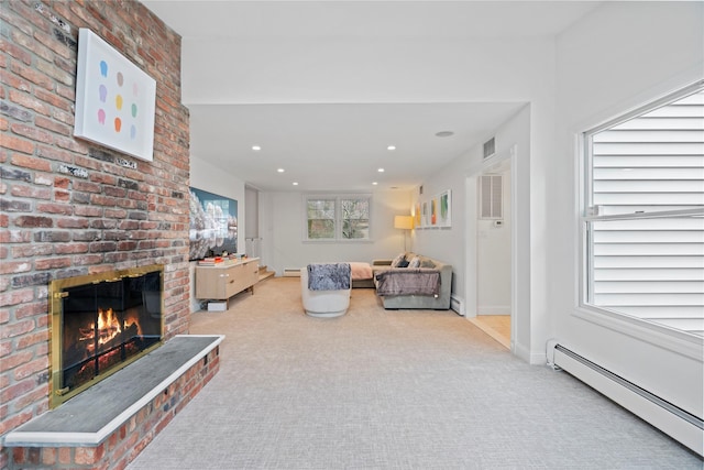 living room featuring a brick fireplace, a baseboard radiator, and light carpet