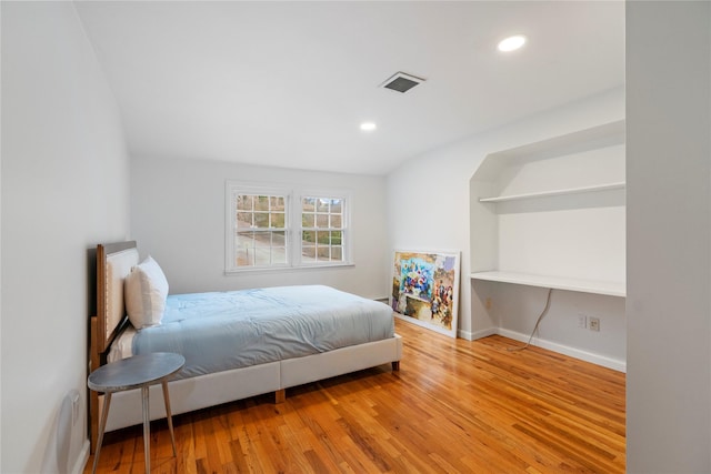 bedroom with wood-type flooring