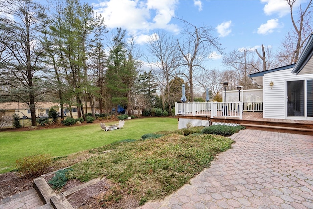 view of yard with a wooden deck