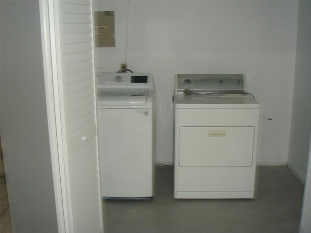 washroom with washer and dryer