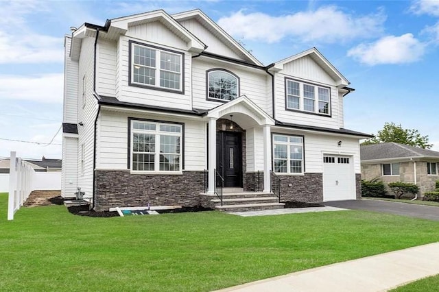 craftsman-style home with a garage and a front lawn