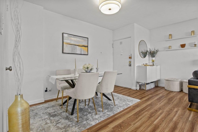 dining space featuring hardwood / wood-style floors