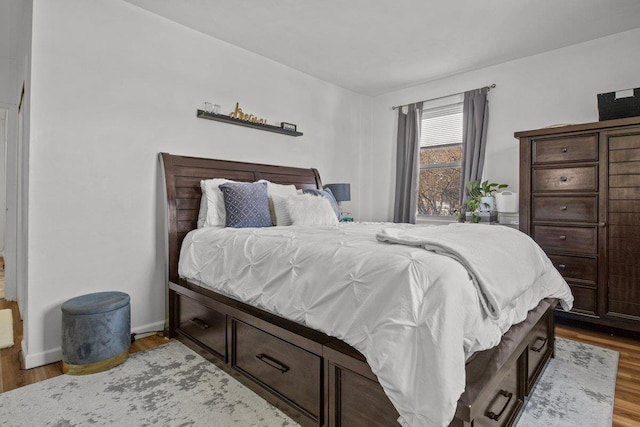 bedroom with hardwood / wood-style floors