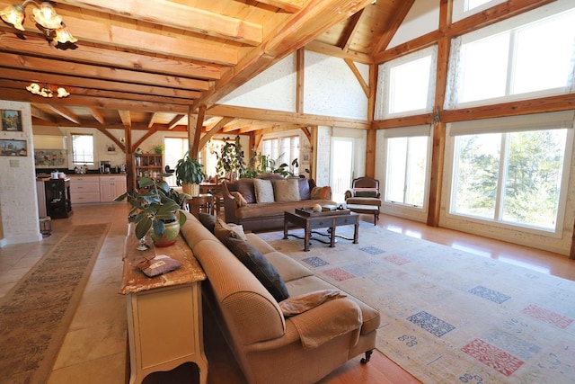 tiled living room with beamed ceiling, a healthy amount of sunlight, and high vaulted ceiling