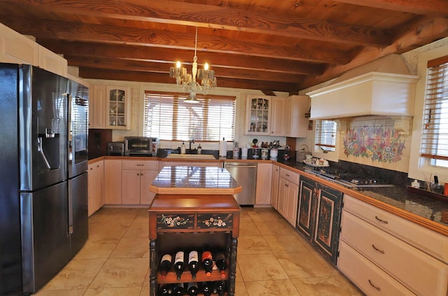 kitchen featuring beam ceiling, wood ceiling, stainless steel appliances, custom range hood, and an inviting chandelier