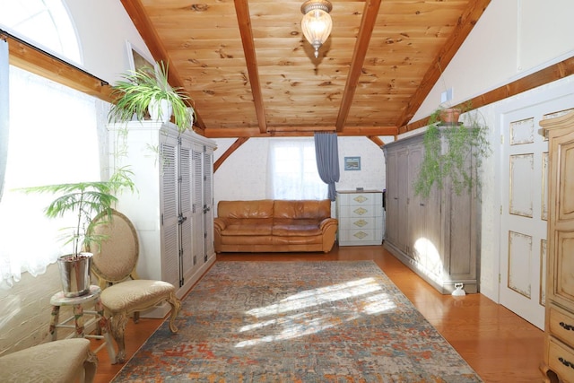 bonus room with lofted ceiling with beams, hardwood / wood-style floors, and wooden ceiling