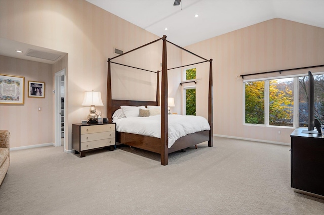 bedroom featuring vaulted ceiling, ceiling fan, and light colored carpet