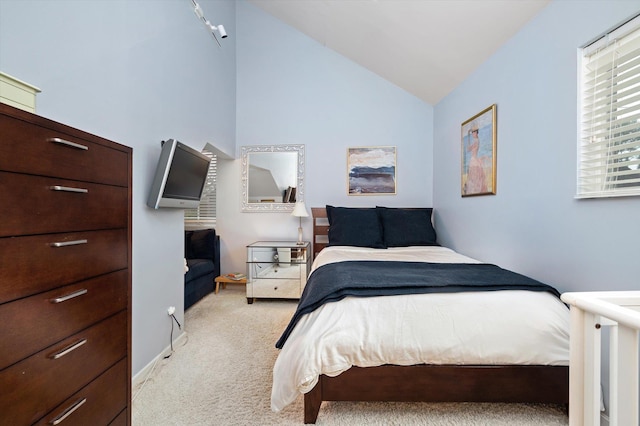 carpeted bedroom with vaulted ceiling