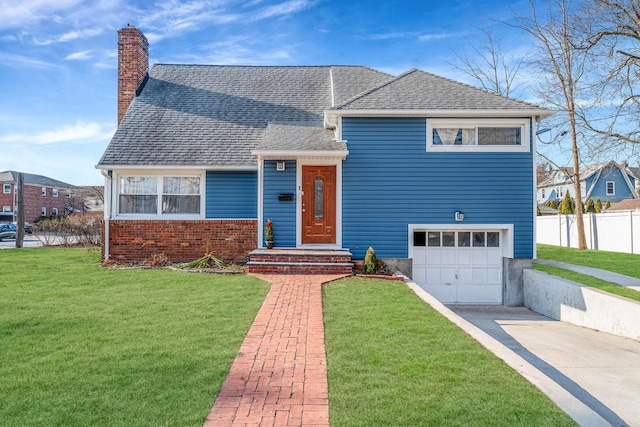 view of front facade with a garage and a front lawn