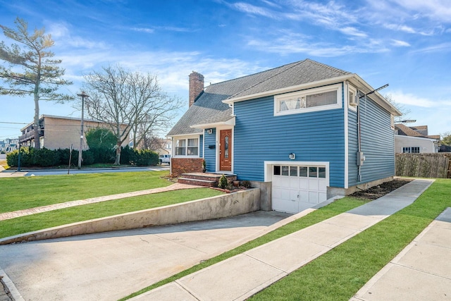 split level home featuring a front yard and a garage