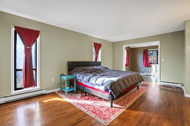 bedroom featuring a baseboard radiator and wood-type flooring