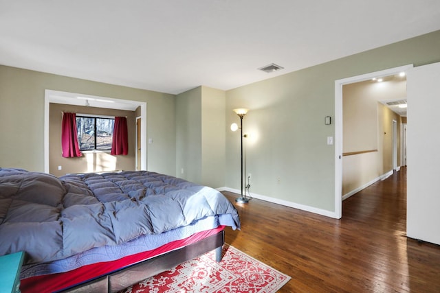 bedroom featuring dark hardwood / wood-style flooring