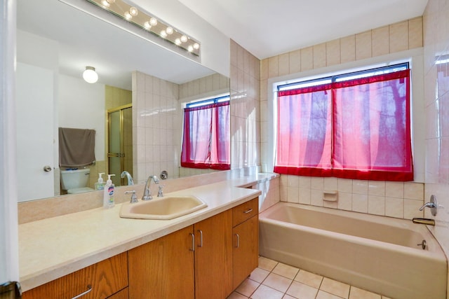 bathroom with walk in shower, tile patterned floors, toilet, and vanity