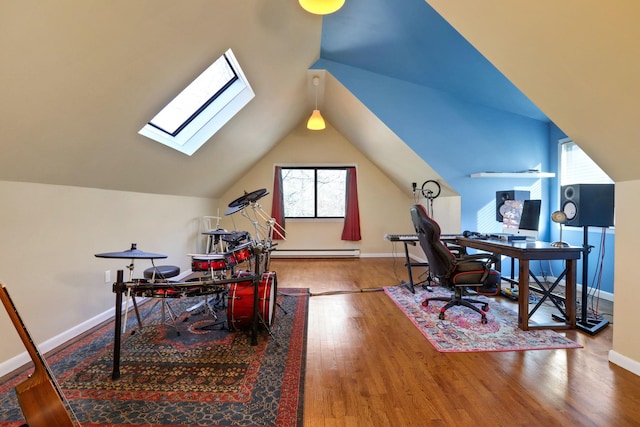 home office featuring lofted ceiling, a baseboard heating unit, and hardwood / wood-style flooring