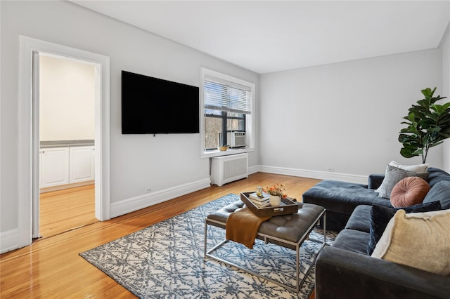 living room featuring radiator and hardwood / wood-style flooring